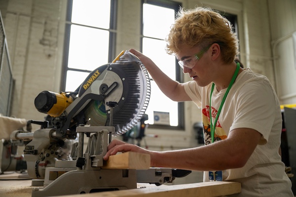 iSTEM camper using shop equipment